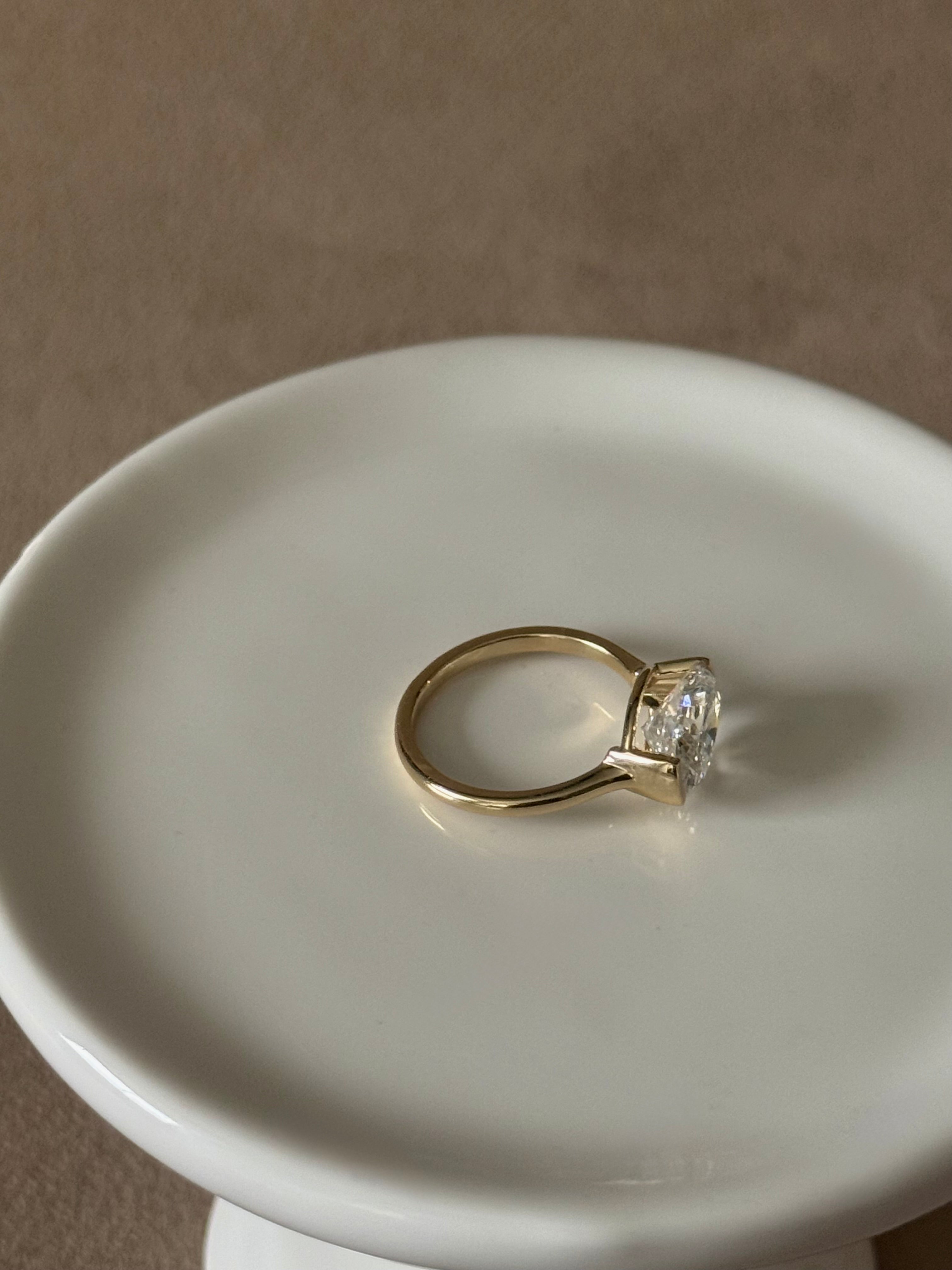 Sample—The Naomi: East-West Half Bezel Oval-Cut Lab Diamond Solitaire Ring