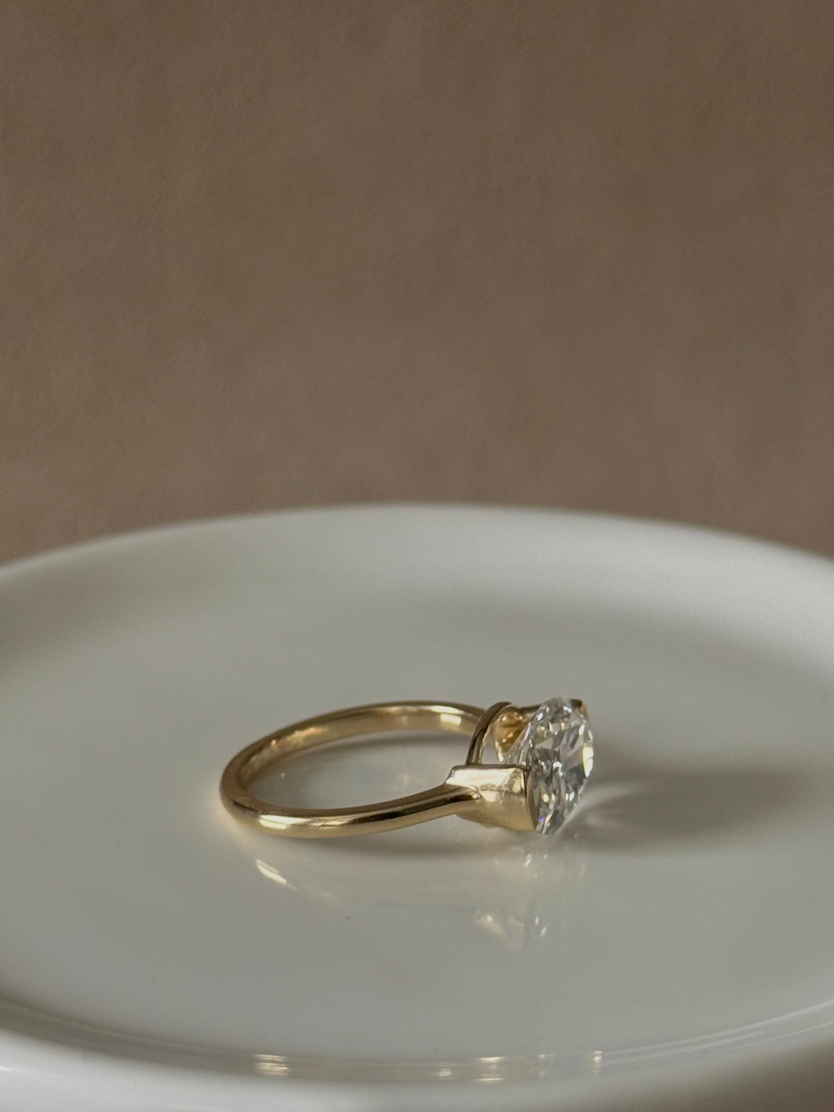 Sample—The Naomi: East-West Half Bezel Oval-Cut Lab Diamond Solitaire Ring