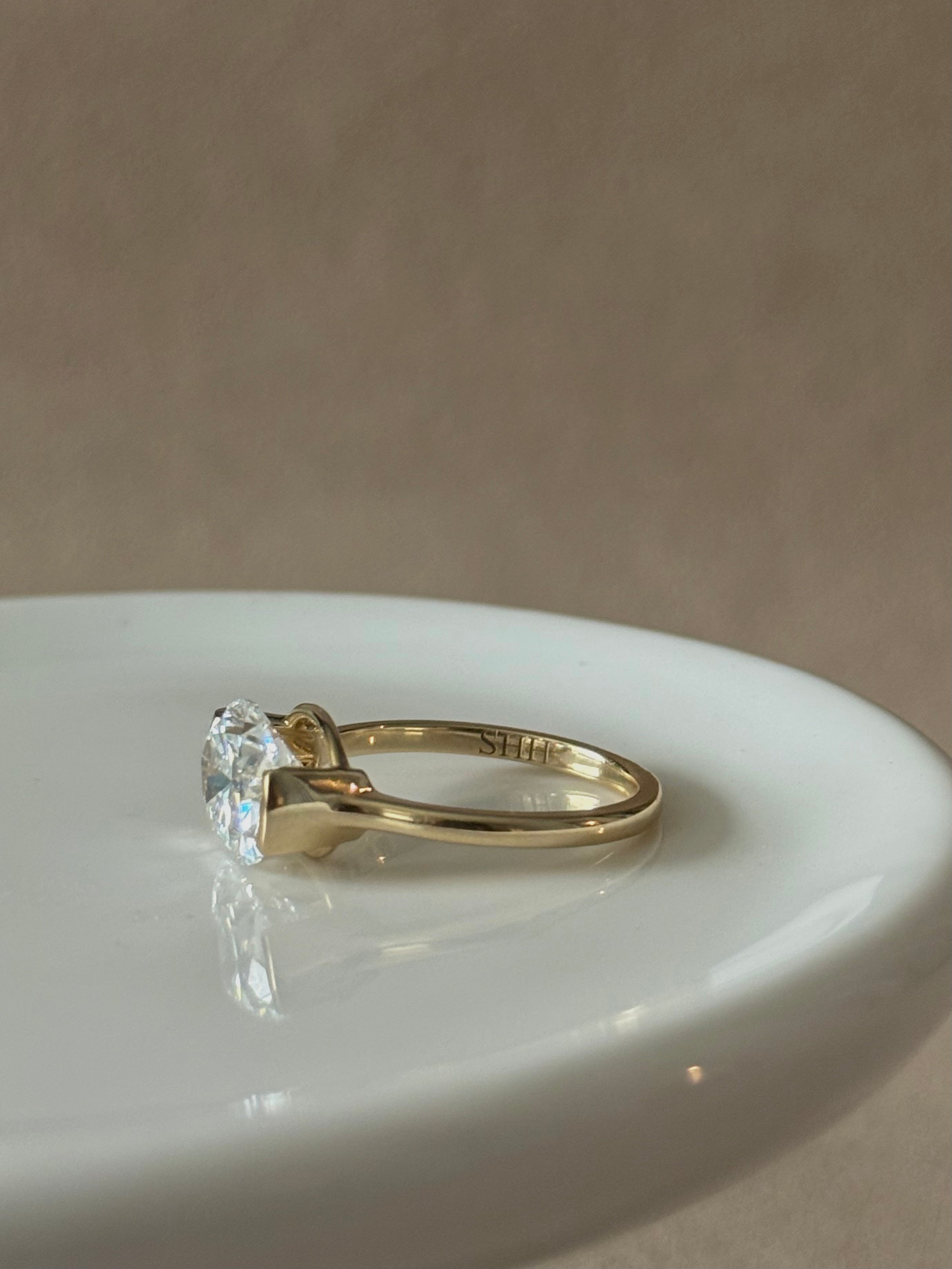 Sample—The Naomi: East-West Half Bezel Oval-Cut Lab Diamond Solitaire Ring